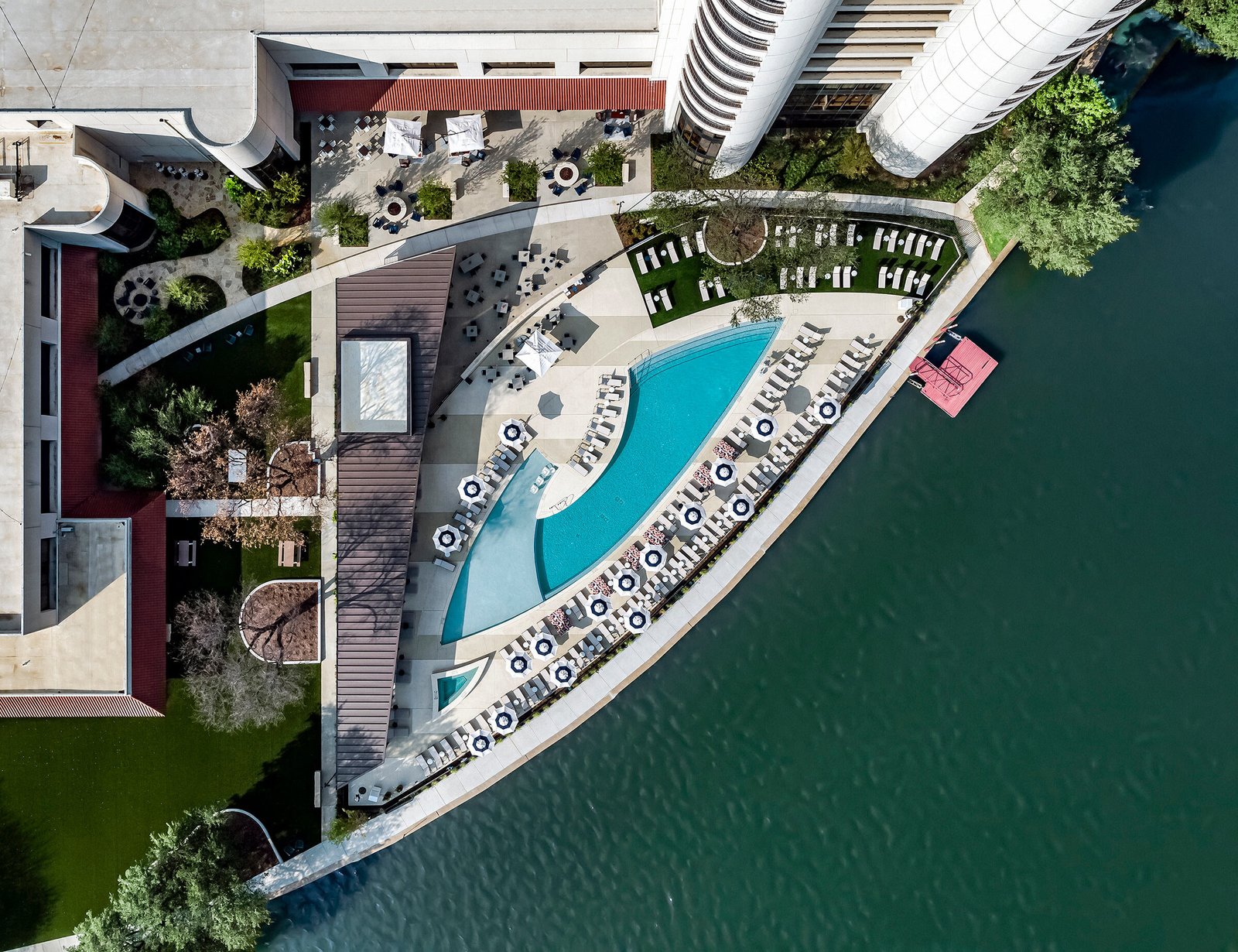 Bird's-eye-view-of-the-pool-along-Lake-Carolyn's-edge-installed-at-Omni-Las-Colinas.jpg